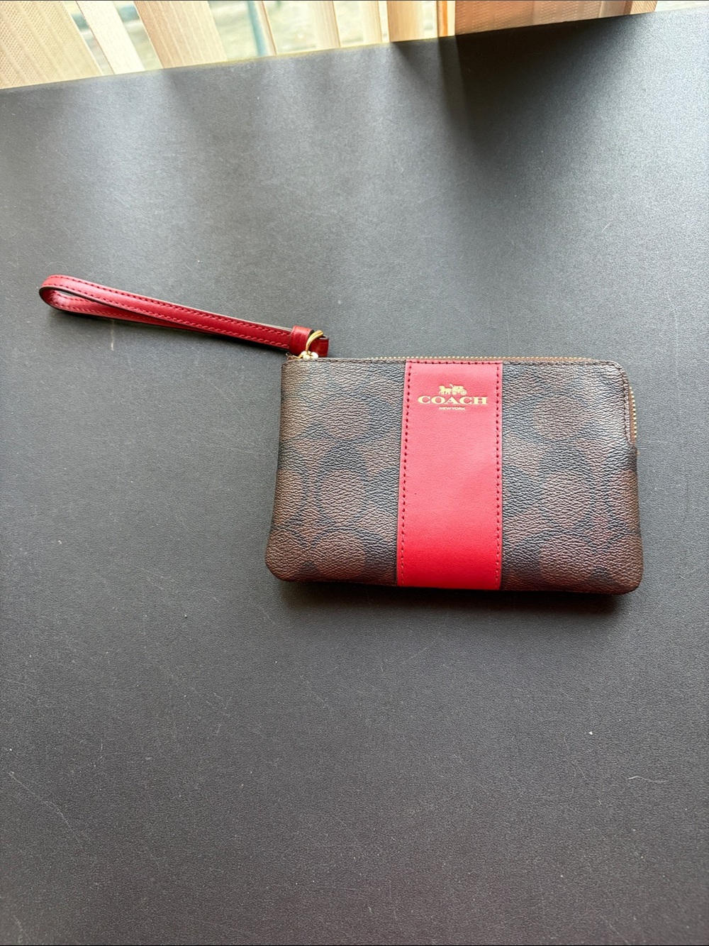 COACH Brown Signature Wristlet with Red Center Stripe